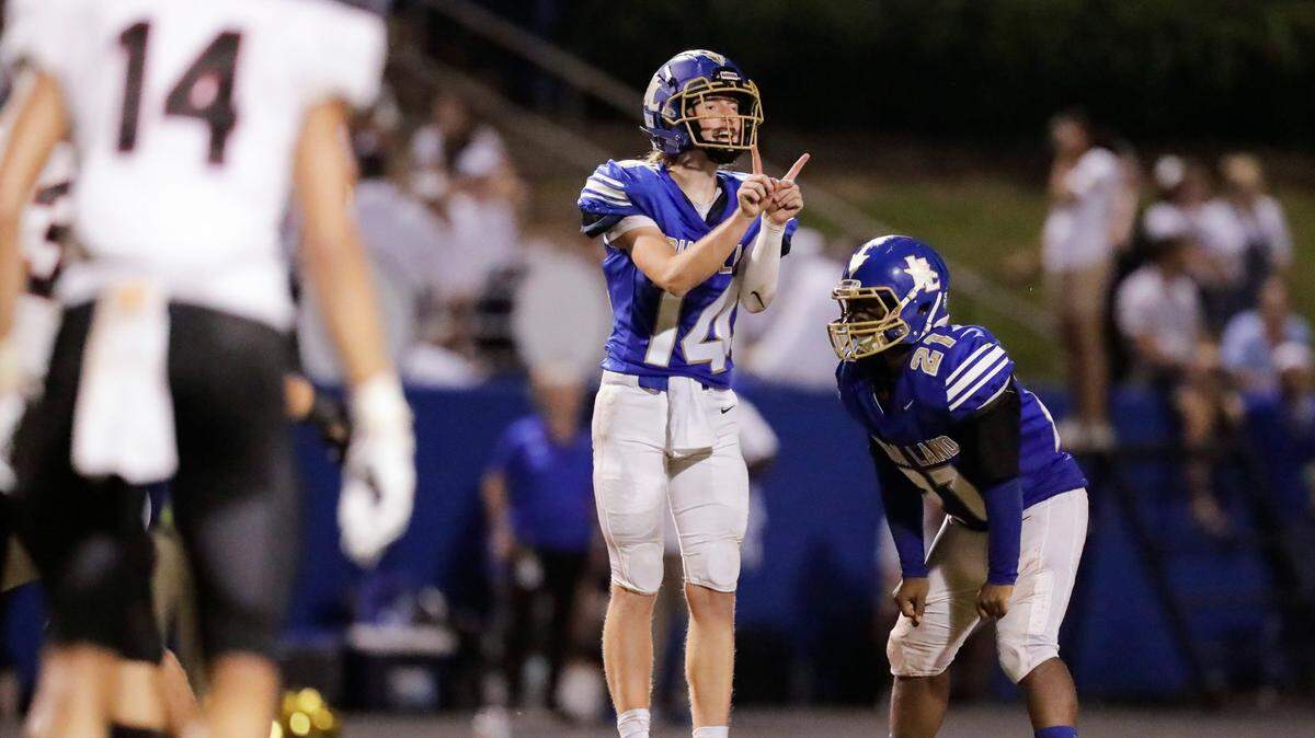 Indian Land quarterback Blake Goode calls an audible at the line of scrimmage in the Warriors’ season opener against Nation Ford Aug. 20, 2021. Indian Land played at its new stadium Friday night (Sept. 10).