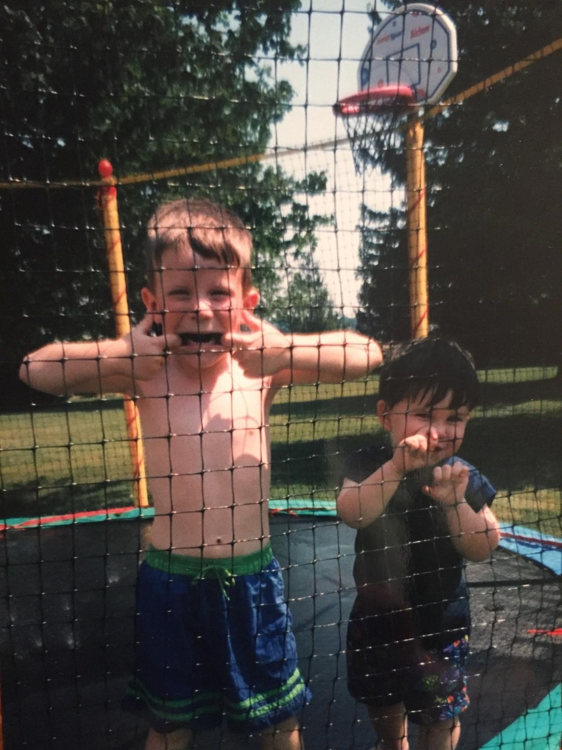 Chandler, right, and his brother, Chaese, pose for a picture on the trampoline in the backyard.