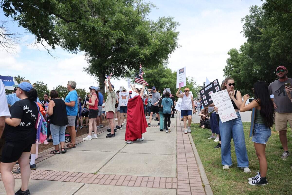 Hundreds of people gathered Saturday, June 14,, 2025 in downtown Rock Hill to protest the Trump administration.