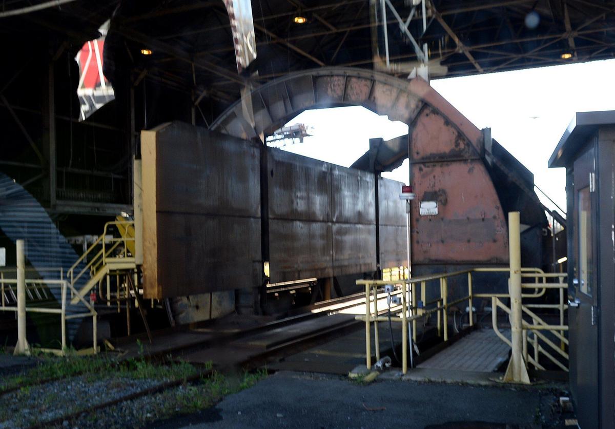 A rail car dumper is appropriately named. Rail cars, loaded with coal, enter the dumper and are flipped to remove the cargo. Open since 1957 the G. G. Allen Steam Station, a 1.140 GW coal-fired electricity generating facility in Belmont on Lake Wylie, is being decommissioned.