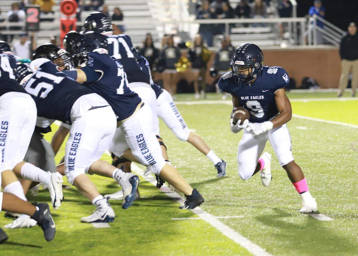 Clover’s Elijah Farmer looks for an opening in the Gaffney defense on Friday night in Memorial Stadium.