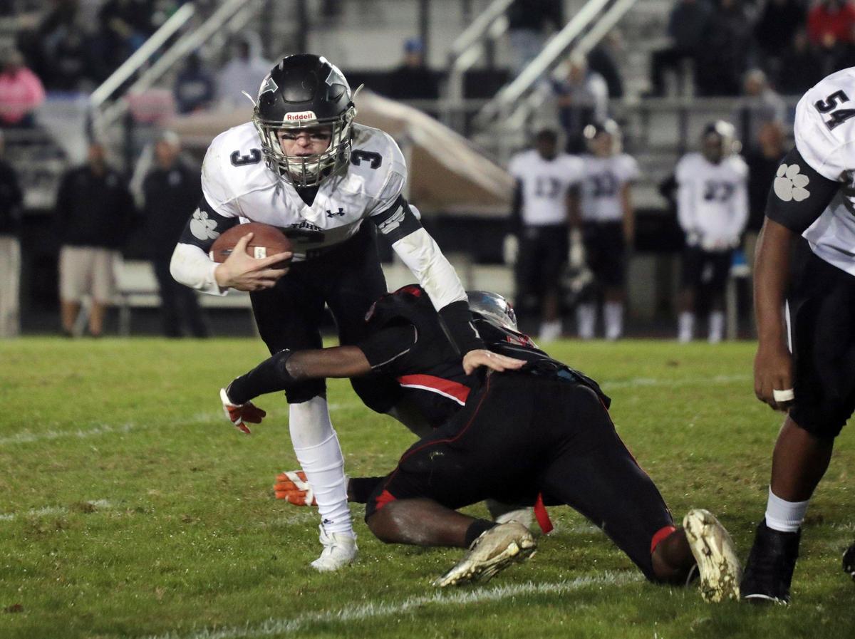 York’s Colby Clayton is tackled by South Pointe’s Choncey Massey Friday. The York Cougars competed with the South Pointe Stallions at District Three Stadium.