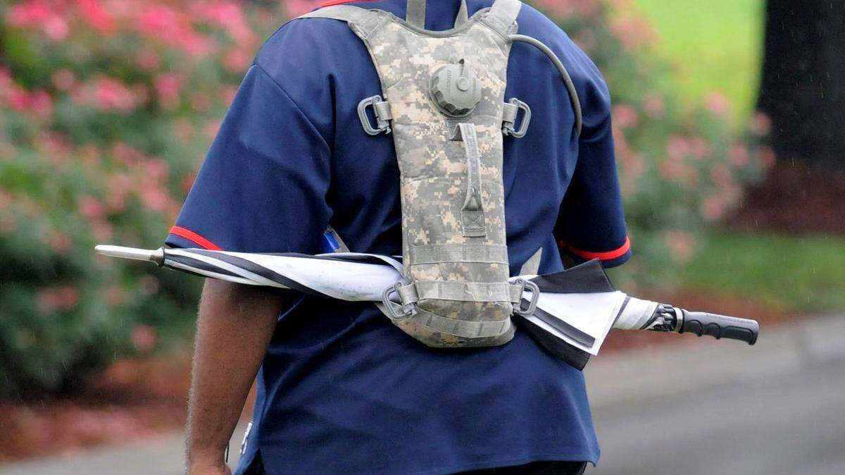 David Goggins walks with an umbrella Tuesday in Rock Hill.