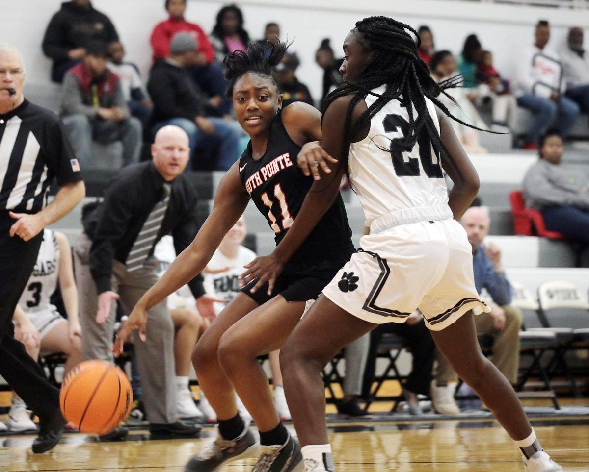 South Pointe senior Najah Lane, pictured here as a sophomore, dribbles around York’s Ja’Niya Coffey at York Comprehensive High School. Lane will be a key piece for the Stallions as they aim for their third state championship appearance in four years.