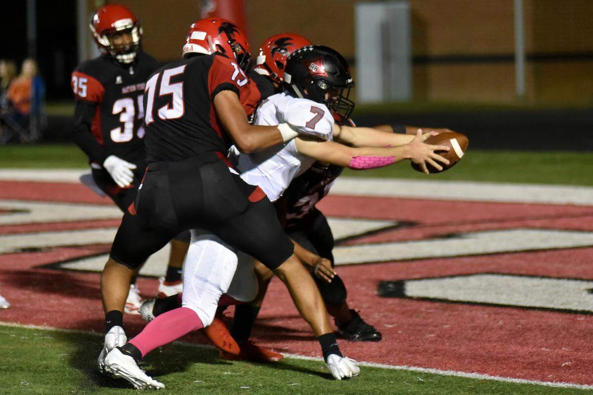 Rock Hill senior quarterback Jordan Thurmond stretches to get the ball into the endzone for the Bearcats’ third touchdown before halftime Friday night at Nation Ford.