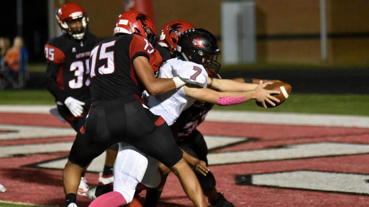 Rock Hill senior quarterback Jordan Thurmond stretches to get the ball into the endzone for the Bearcats’ third touchdown before halftime Friday night at Nation Ford.