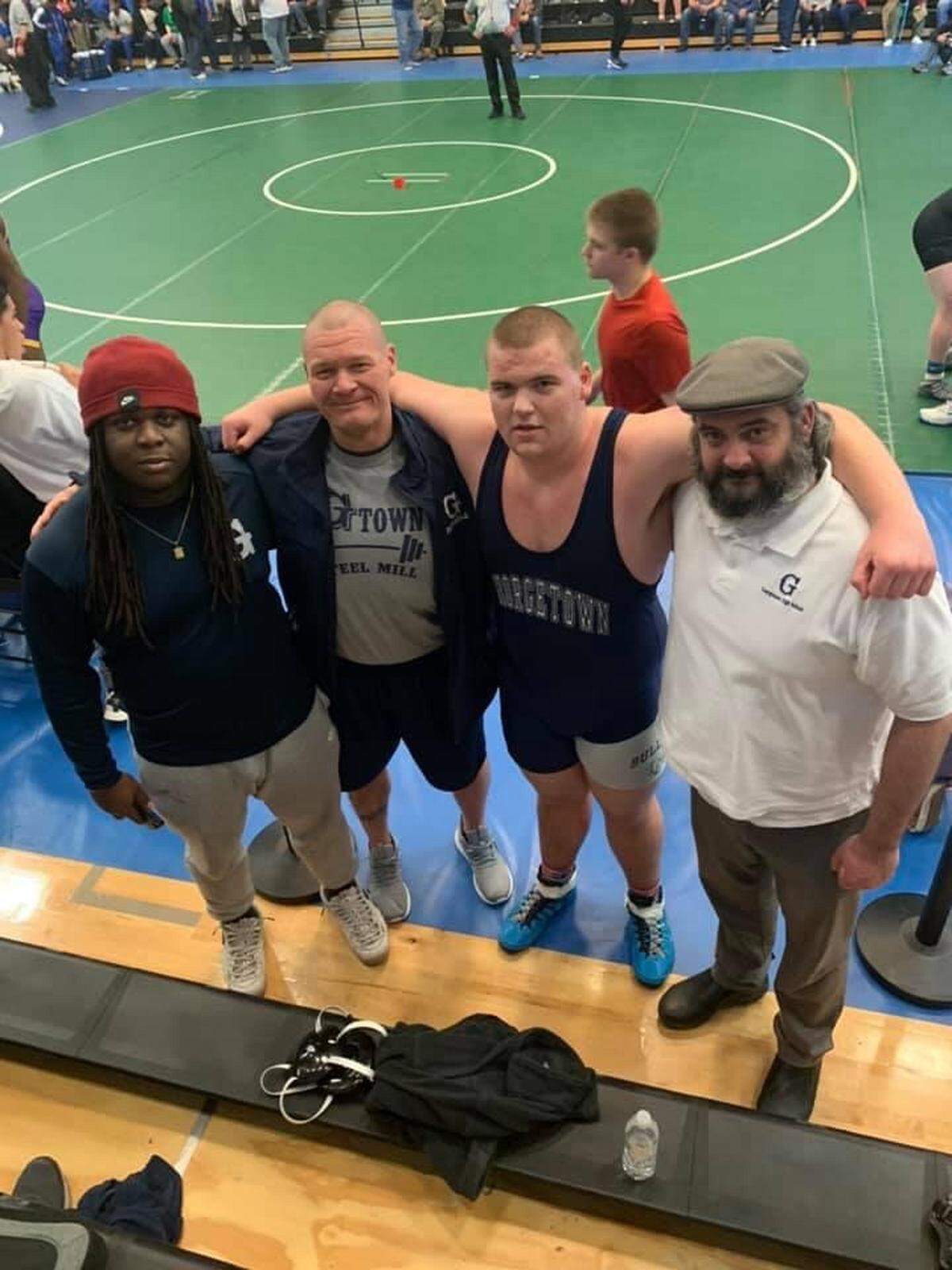 Coleman, left-center, was a wrestling coach at Georgetown High School in SC at one point, too.