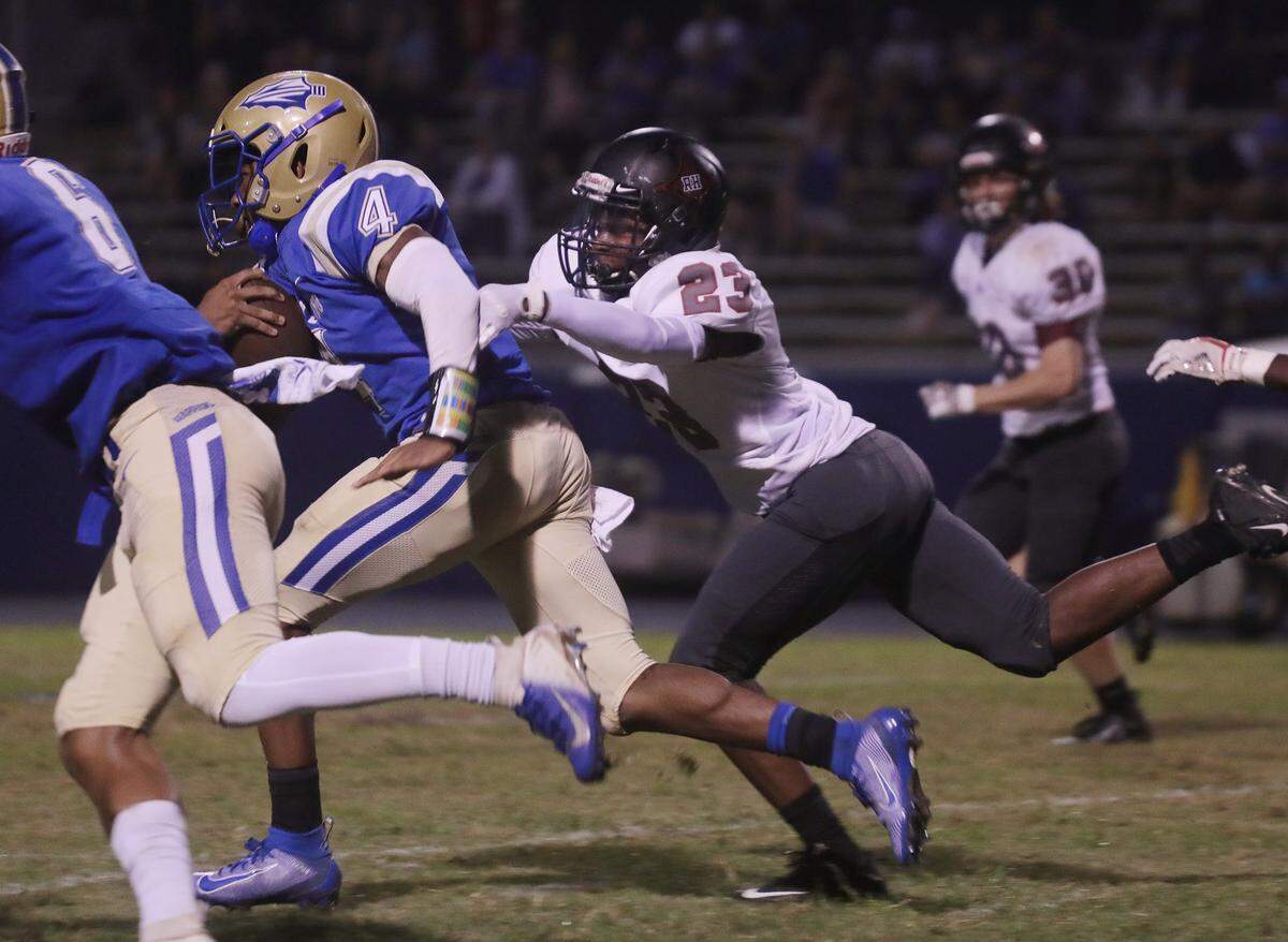 Rock Hill’s Regan Chisolm (23) tries to chase down Indian Land’s Jaden Peoples Friday night in Indian Land.