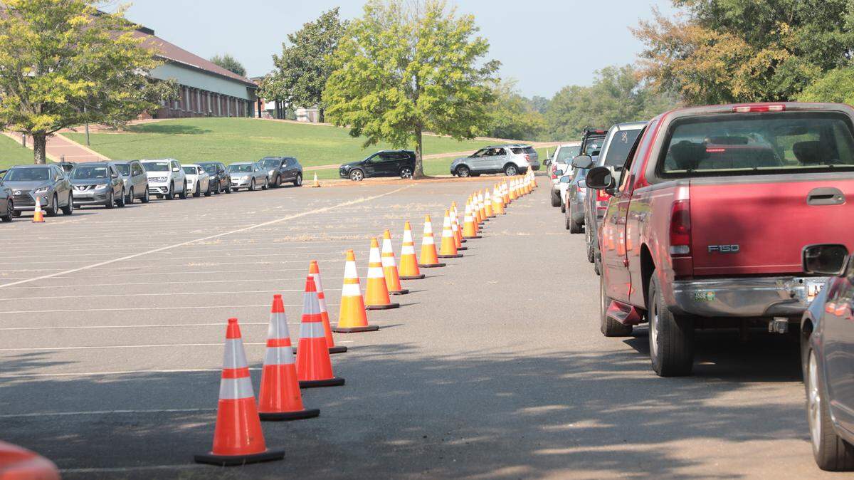 A long line of cars snakes its way through the Winthrop Coliseum parking lot Wednesday at a Covid testing site. The line extended down Eden Terrace.