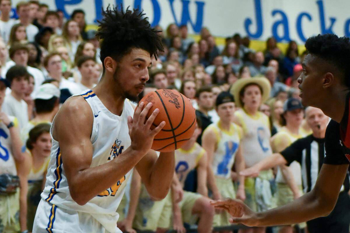 Fort Mill’s Keyan Mims sizes up Nation Ford’s Khydarius Smith in a game at Fort Mill in January 2019. Nation Ford defeated Fort Mill 70-63.