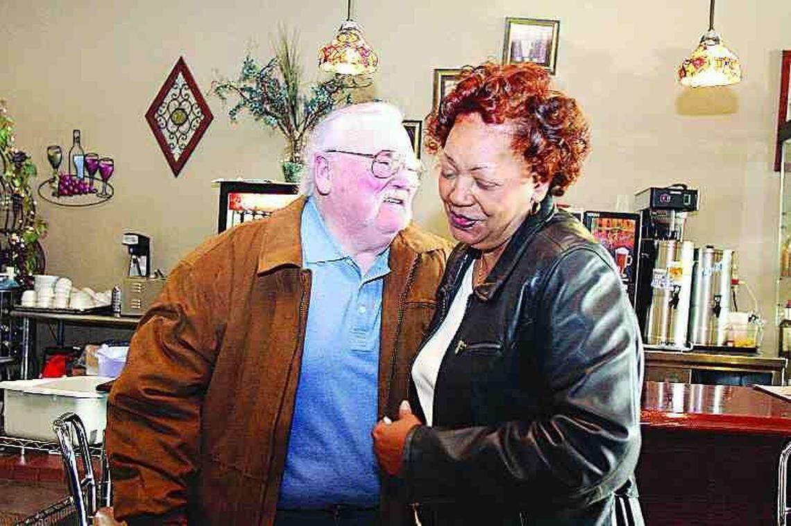 Steve Coleman, left, hugs Phyllis Hyatt, one of the "City Girls" from the civil rights demonstrations in Rock Hill in the 1960s, after meeting Friday and apologizing for his actions against blacks during that time. They were at Old Town Bistro on East Main Street in downtown Rock Hill. The lunch counter in the background was the site of demonstrations when the building was McCrory's.