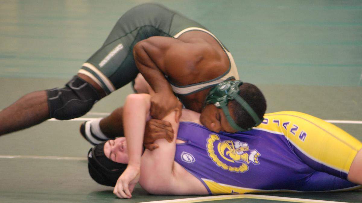 Catawba Ridge’s RJ Lincoln, top, gets his Northwestern opponent into position before pinning him during a recent match.
