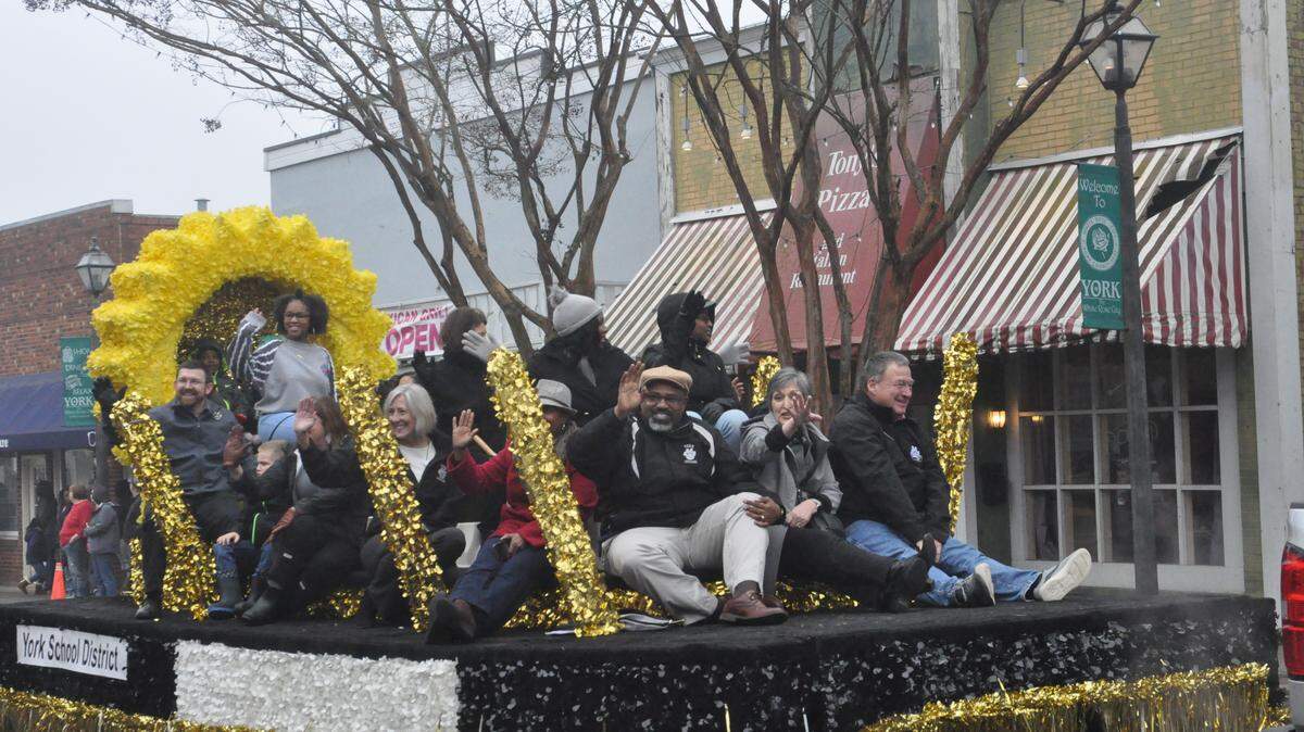 In this Herald file photo, York school district representatives wave from a float during the MLK Day parade. The Western York County NAACP was recognized by the South Carolina General Assembly in 2017 for founding the oldest continuous MLK parade in the state.