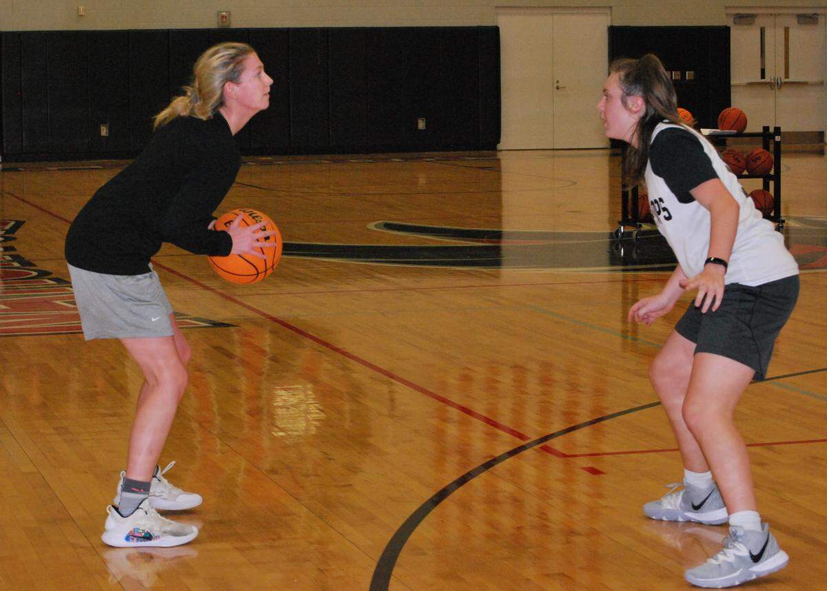 Nation Ford senior Kelci Adams, with the ball, looks to drive to the basket against a teammate during a recent practice.