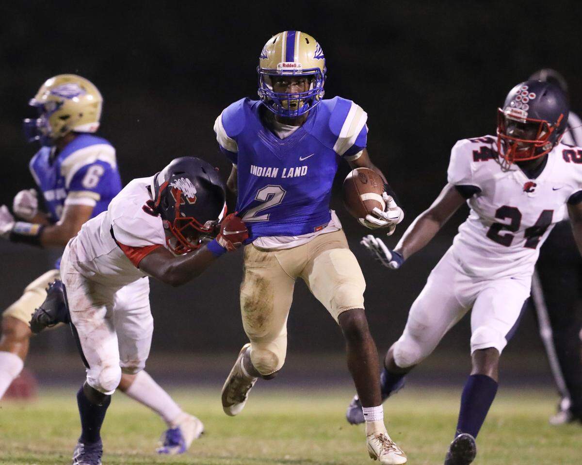 Indian Land’s Deaviaun Moran is taken down by Chester’s Stan Mills Friday. The Warriors hosted the Cyclones in varsity football in Indian Land.