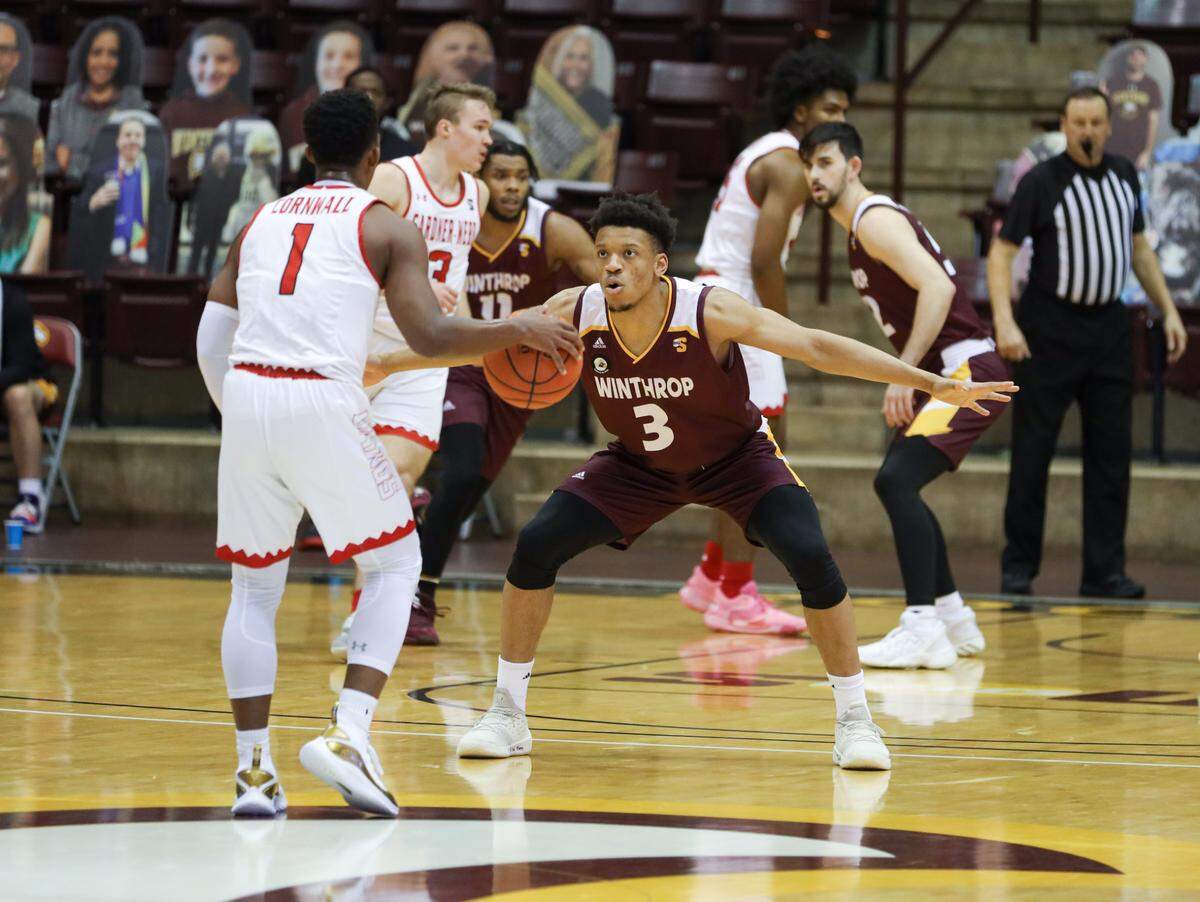 Herald file: Micheal Anumba defends a Gardner-Webb guard in Rock Hill in 2020.