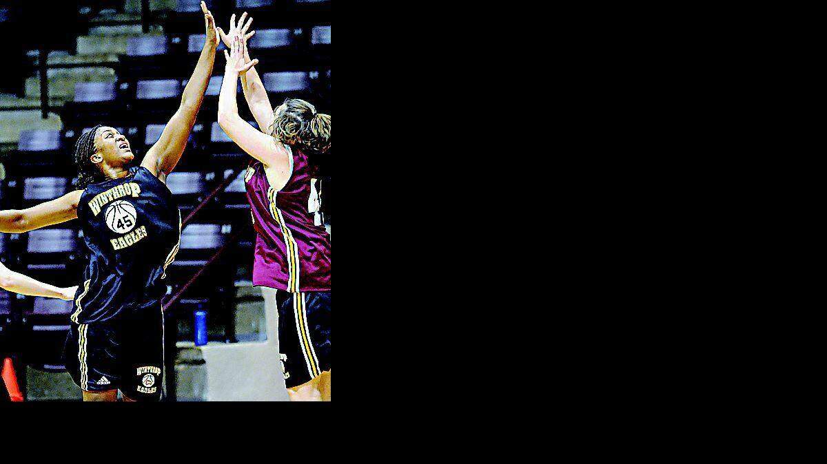 Winthrop's Jennifer Walker, left, defends during practice Wednesday in Winthrop Coliseum.