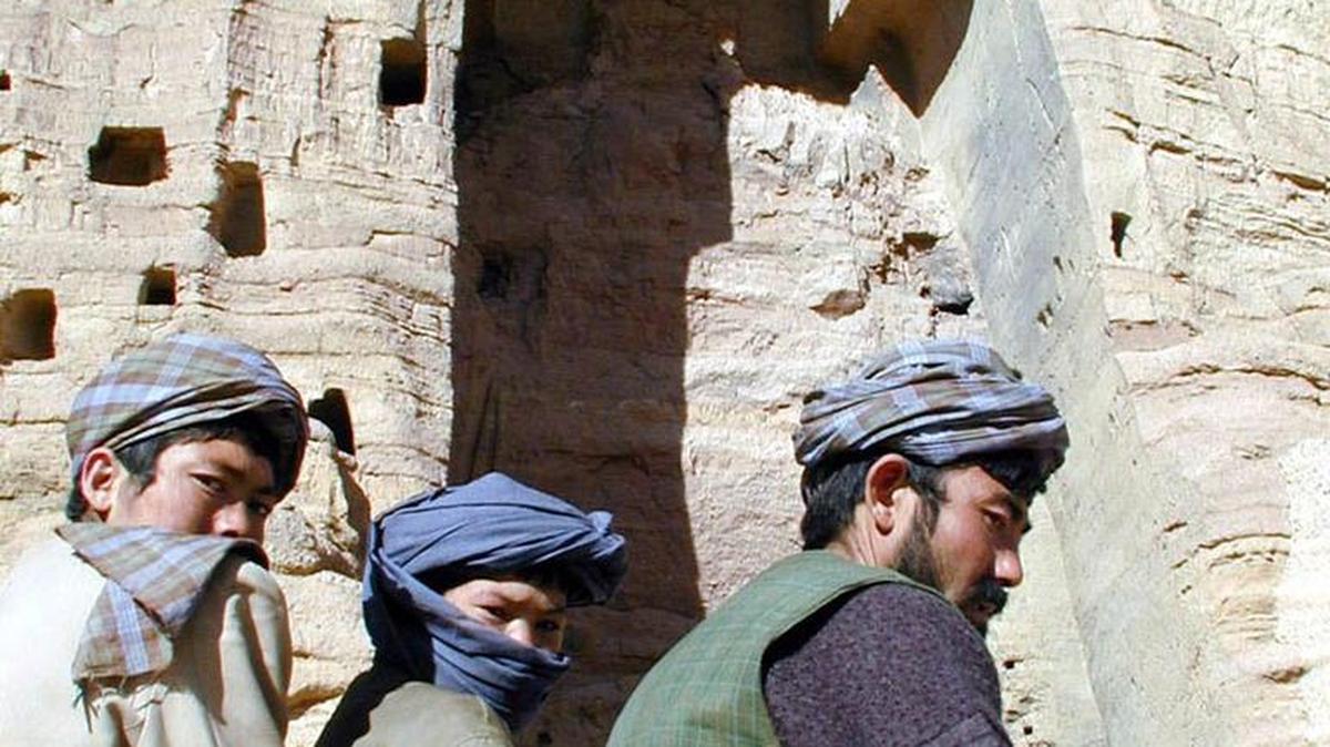 
Hazara militiamen sit on a rock in front of the cavity where the larger of the two Buddhas once stood in Bamian, Afghanistan, in 2001. They had been destroyed by the Taliban.
