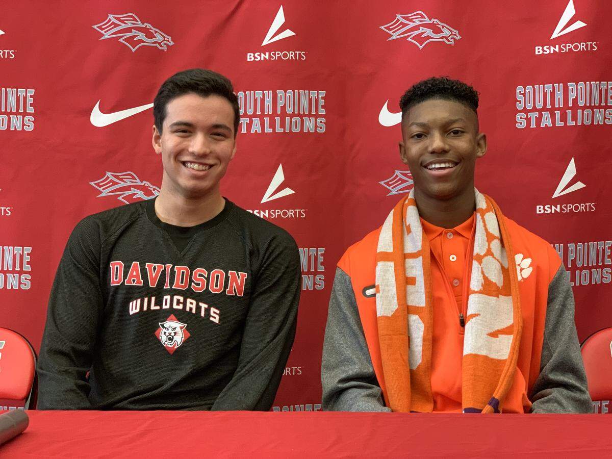 South Pointe’s Maurilio Saddoud (left) and Isaiah Reid signed with Davidson (swimming) and Clemson (soccer) on Wednesday morning, Nov. 14, 2018.
