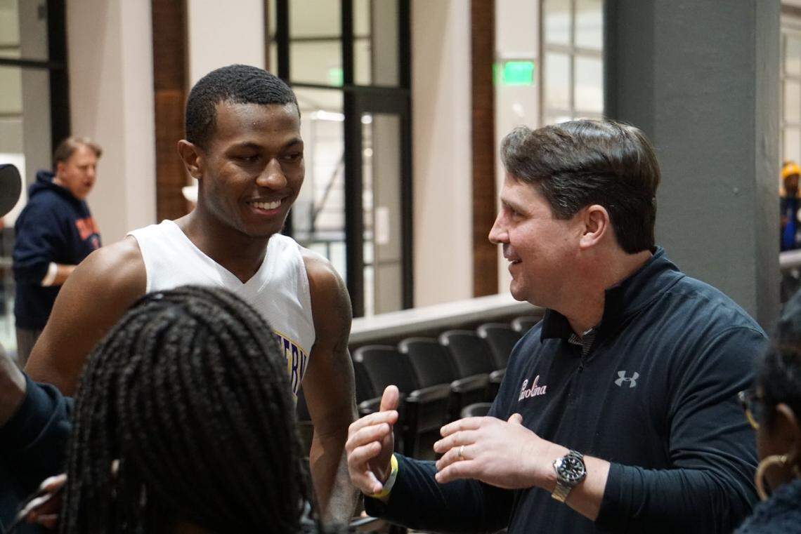 Northwestern forward and football wide receiver Ger-Cari Caldwell and South Carolina head football coach Will Muschamp speak after Caldwell’s basketball game over the MLK holiday in January 2020.
