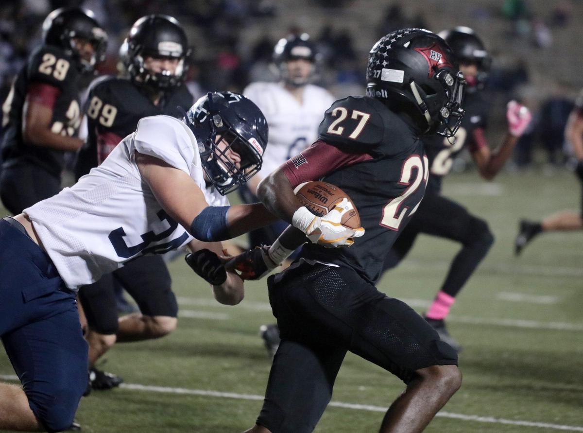 Rock Hill’s Tylik Edwards carries the ball on Friday, Oct. 18 as the Bearcats host the Clover Blue Eagles at District Three Stadium.