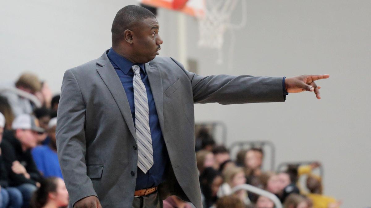 Lewisville boys varsity basketball coach Michael McCray led his team in a valiant effort against rival Great Falls on Saturday night. His team fell, 54-52.