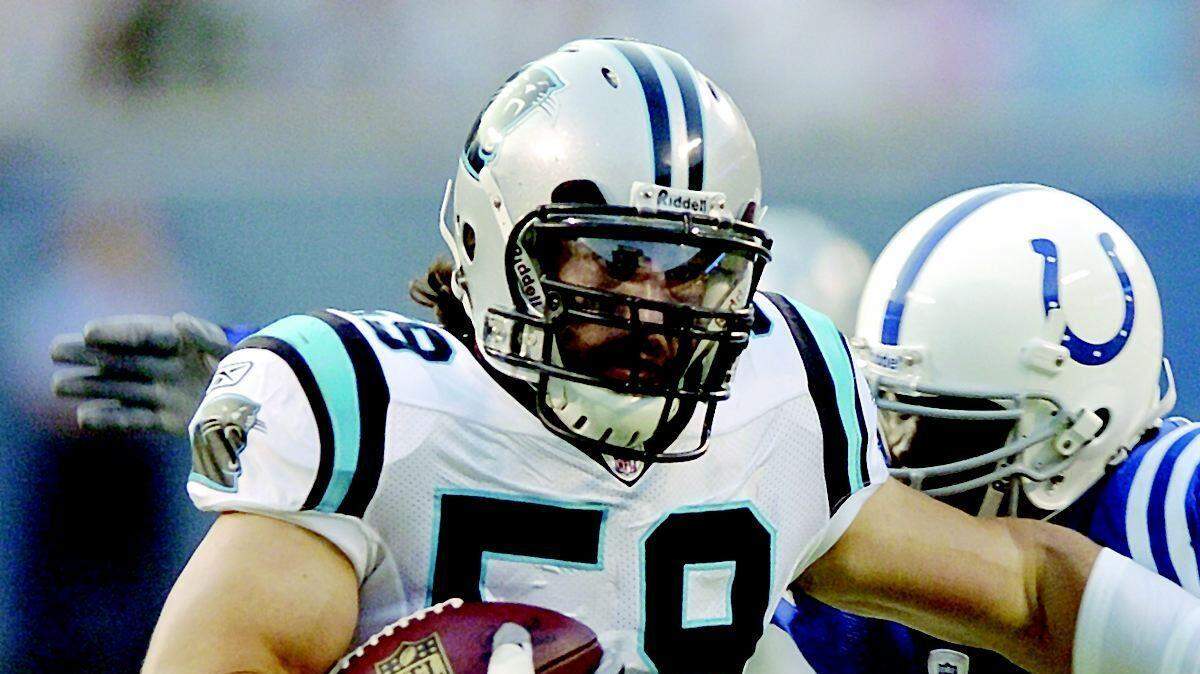 The Panthers' Adam Seward returns an interception as Indianapolis' Joseph Addai defends in the first quarter Saturday.