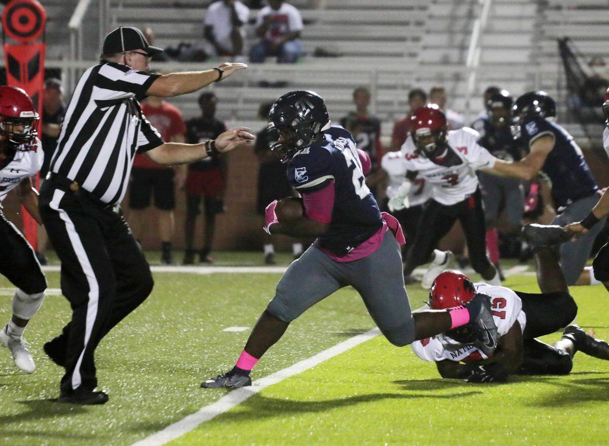 Clover’s B.J. Tims carries the ball Friday as the Blue Eagles compete with Nation Ford in varsity football in Clover.