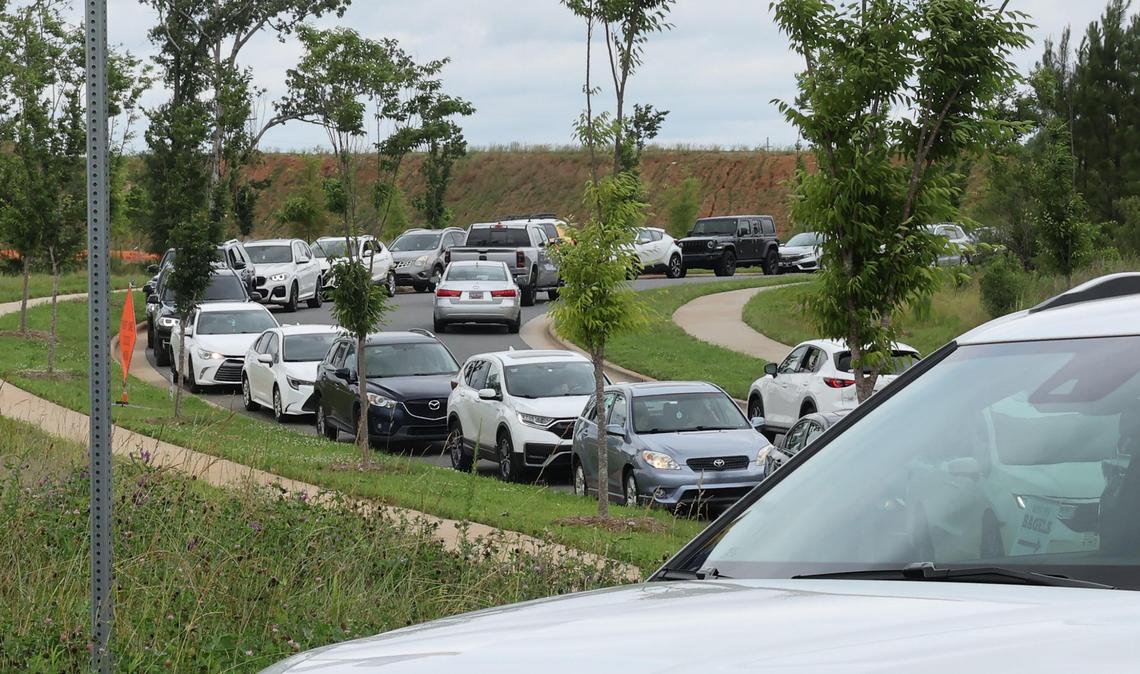 Cars line Worldreach Drive behind Swig, a popular drink shop in Indian Land, S.C. on Friday. Herald reporter John Marks waited over an hour in line at Swig to see why the drinks are drawing crowds from Charlotte and the Rock Hill region.