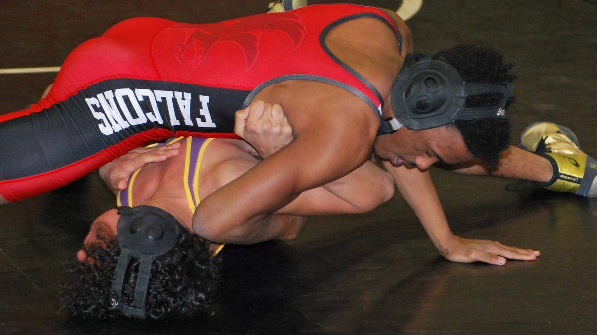 Nation Ford’s Solomon Moore, top, looks to pin Northwestern’s Albert Flores at 113-pounds during the dual match on Tuesday, Jan. 21, 2020.