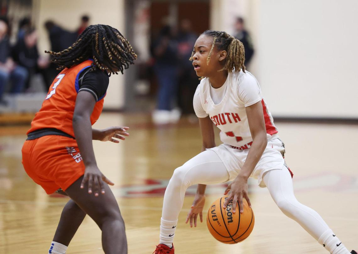 South Pointe’s Kaleigh Lucas tries to get around Richland Northeast’s Ajaela Brown Thursday in Rock Hill.