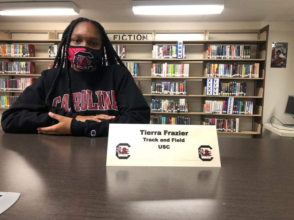 Tierra Frazier signed to run track and field at USC on Wednesday.