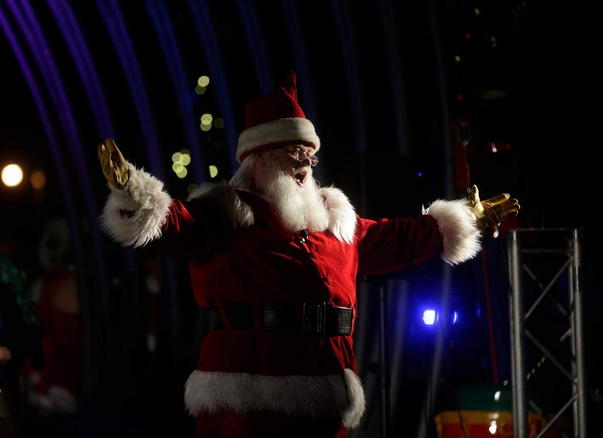 Santa talks to a crowd Thursday at the opening ceremony of ChristmasVille in Rock Hill’s Fountain Park.