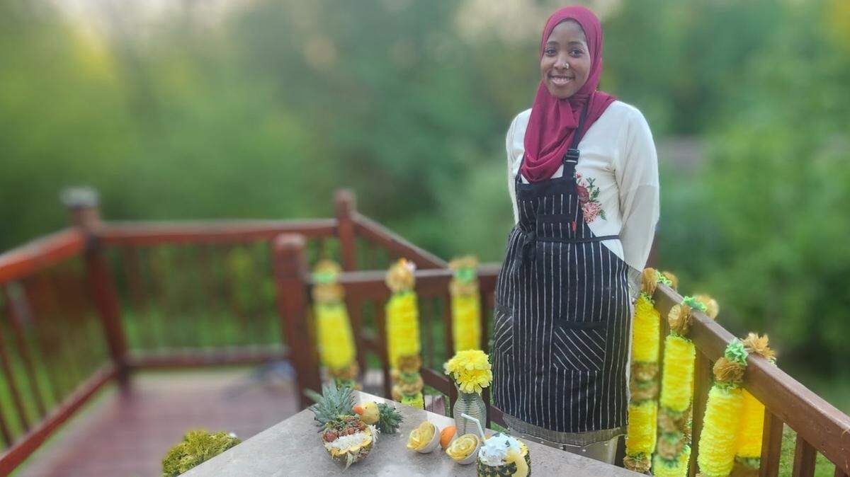 York resident Aliyah Abdallah, 17 with her sweet and sour chicken presented in a pineapple. Abdallah entered the K12 Cook Off and was among six finalists who competed in Arlington, Virginia