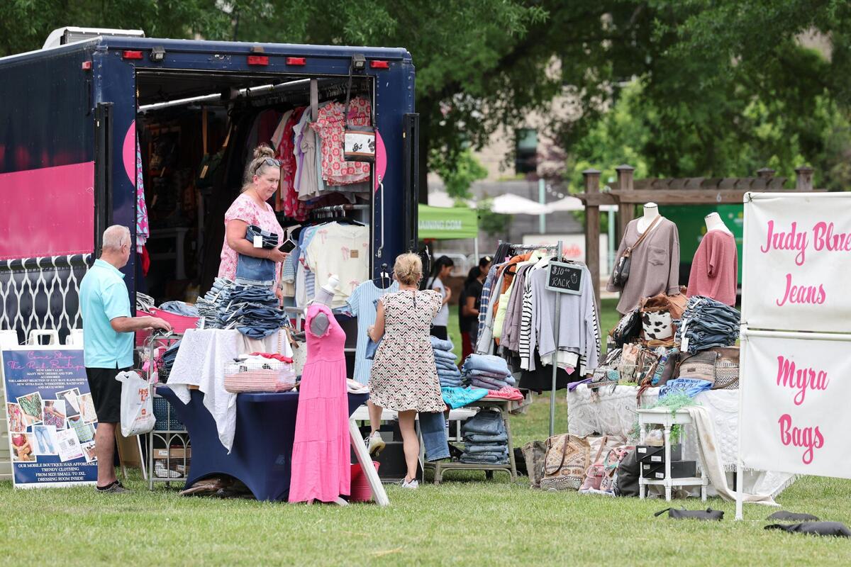 Shoppers browse at the The Pink Boutique at Fort Mill’s Strawberry Festival on Friday, May 2, 2025.