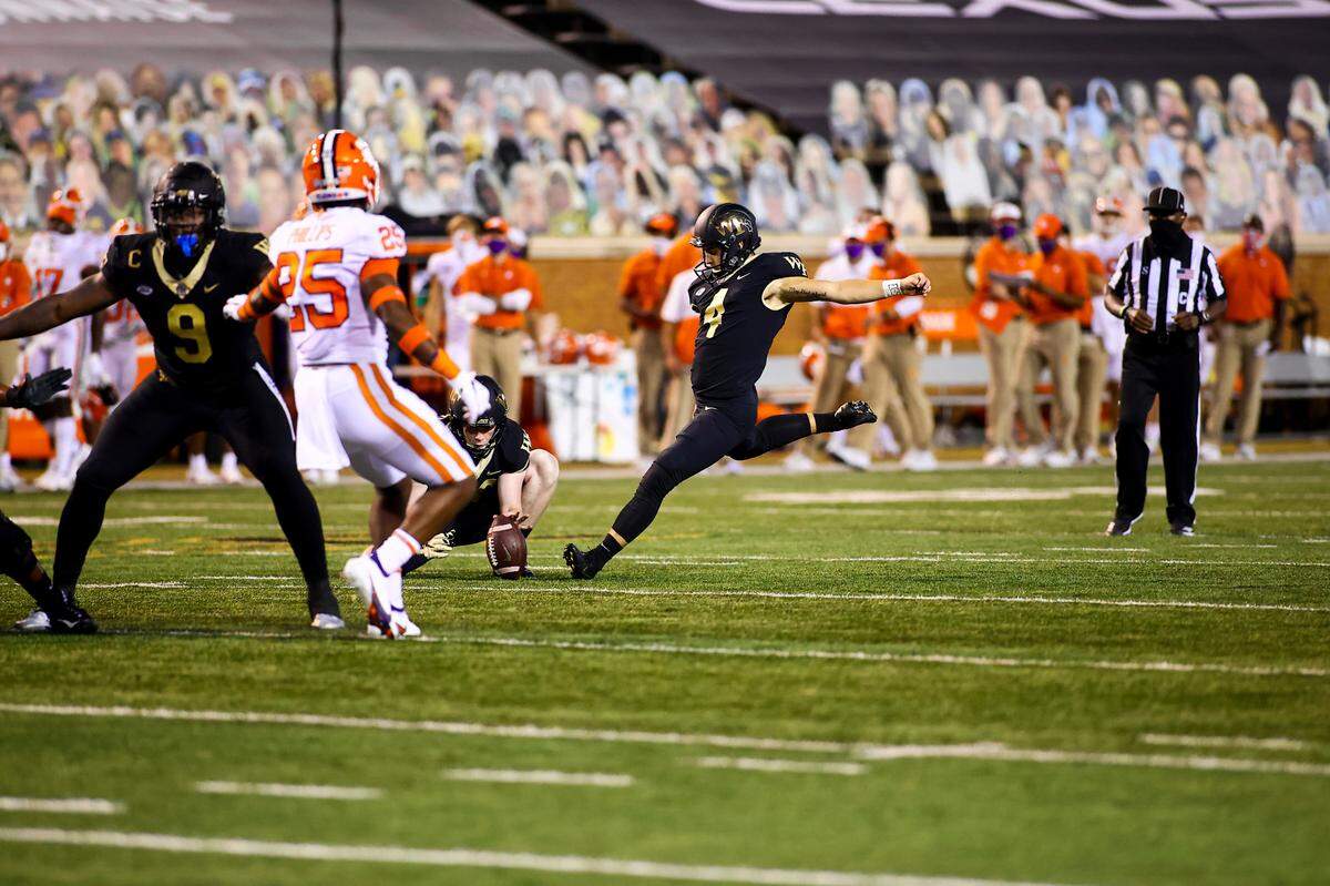 Wake Forest’s Nick Sciba of Clover, S.C., winds up for a kick against Clemson in the 2020 football season.