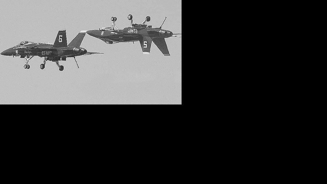 Two Blue Angels jets do a low-level mirror image maneuver during an April 21, 2007, performance at Marine Corps Air Station in Beaufort. The No. 6 plane at left is believed to have crashed about 3 miles from the air station, killing the pilot, Lt. Cmdr. Kevin Davis.