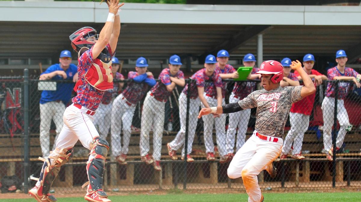 
Nation Ford's Nathan Mahaffey beats Riverside catcher Grant Belanger to home plate to score Saturday afternoon and help keep the Falcons in the playoffs.
