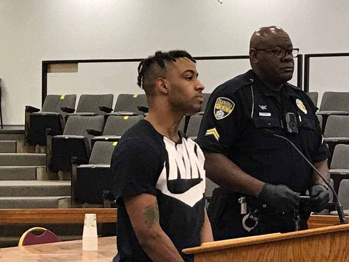 Jamie Gavantay Williams, left, whom court officials said was a fugitive from North Carolina after a May 2021 mall shootout, in court Nov. 24, 2021 after he was charged with a murder in Rock Hill, South Carolina.