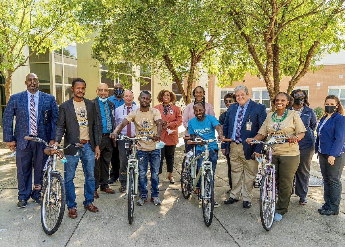 Four teachers from Ghana at Saluda Trail Middle School were surprised with bicycles on Friday, Aug. 27. Those teachers are (from left to right): Aruthur Isaac, Clement Manu, Matthew Eshun and Anne Chege.