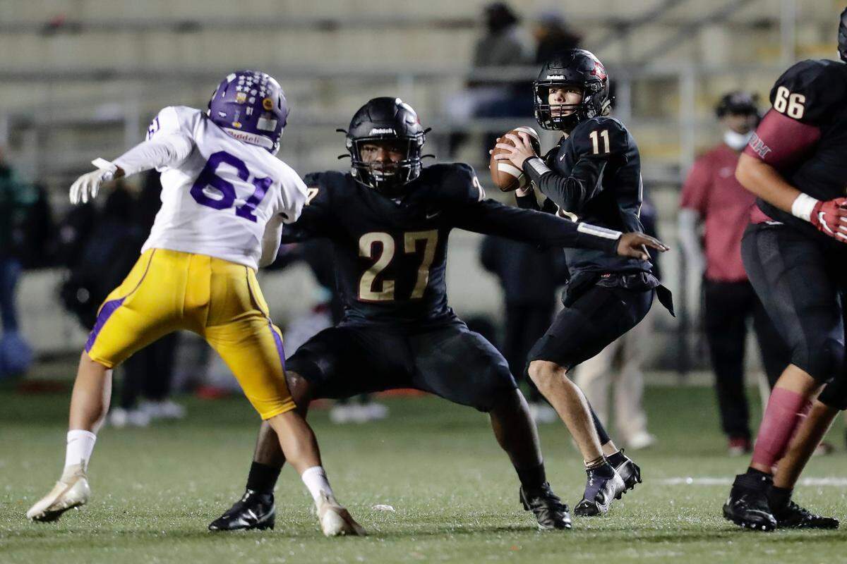 Rock Hill quarterback (11) Jayden Surratt drops back for a pass in late play as Northwestern takes on Rock Hill in Friday night varsity football action, 10-29-2021. Rock Hill travels to Gaffney on Friday (Nov. 5).