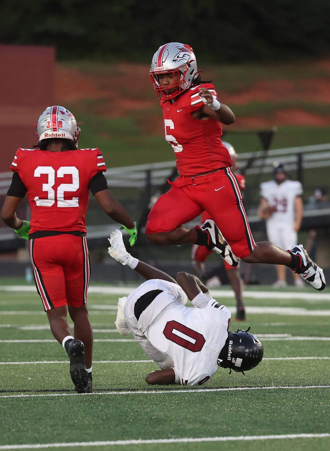 South Pointe's K.J. Burg jumps over Rock Hill's Kimari Barber Friday, Sept. 29, 2025