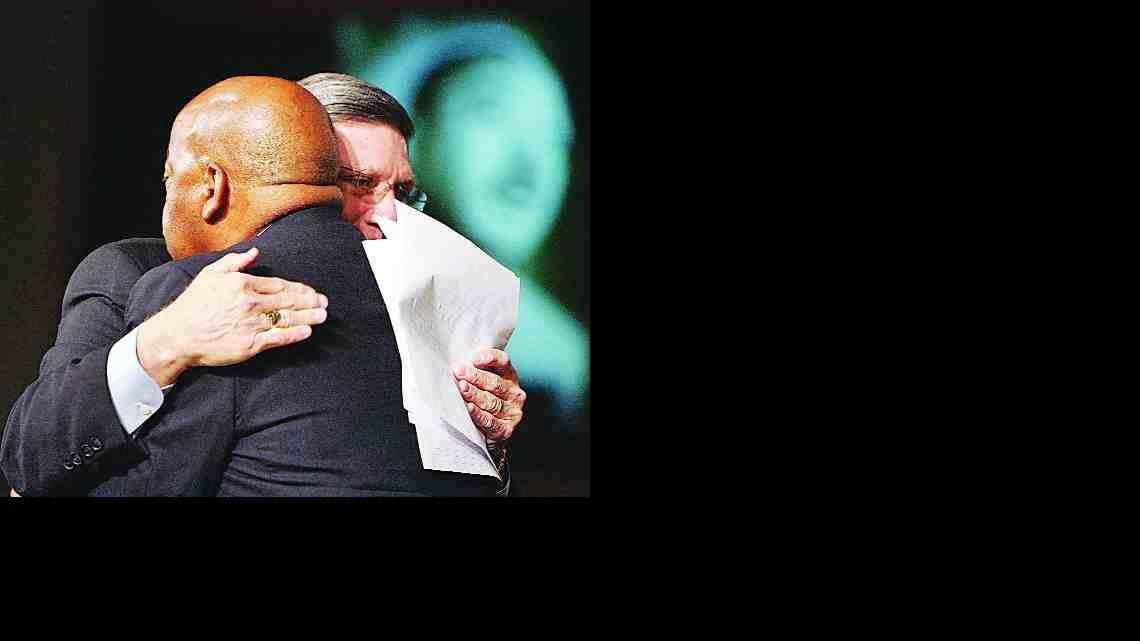 Rock Hill Mayor Doug Echols, right, embraces U.S. Rep. John Lewis, D-Ga., at the fifth annual Martin Luther King Jr. Interfaith Prayer Breakfast at First Baptist Church in Rock Hill on Monday. Echols, on behalf of the city, apologized to Lewis for the beating he received in Rock Hill as he approached the white waiting room in the Greyhound bus terminal during the Freedom Rides in 1961.