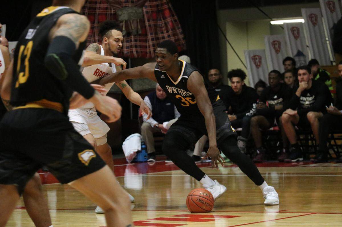 Winthrop’s DJ Burns, who led his team in scoring with 19 points on Jan. 20, 2020, makes a move past his Radford defender.