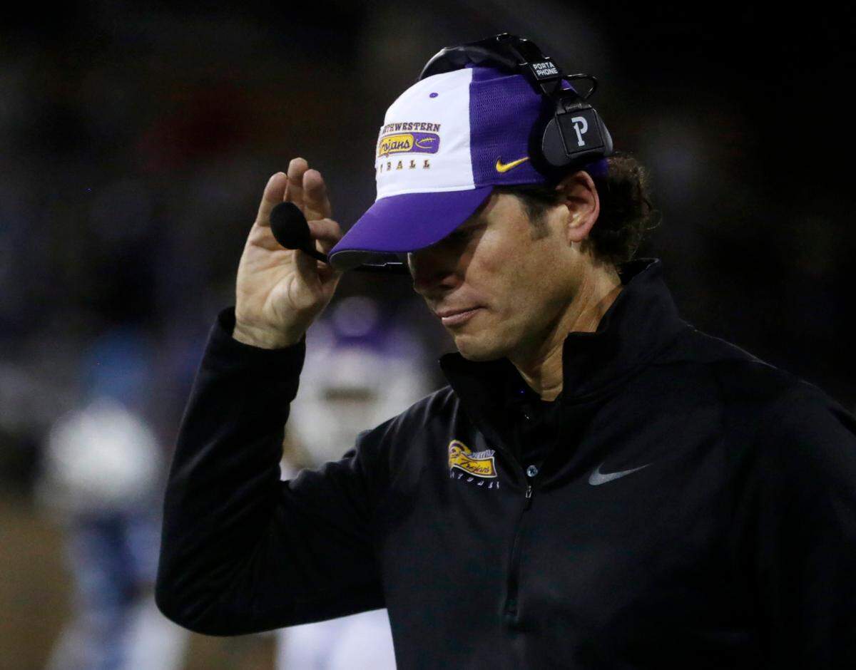 Northwestern head football coach Page Wofford adjusts his headset Saturday at the Class 4A State Championship game in Columbia.