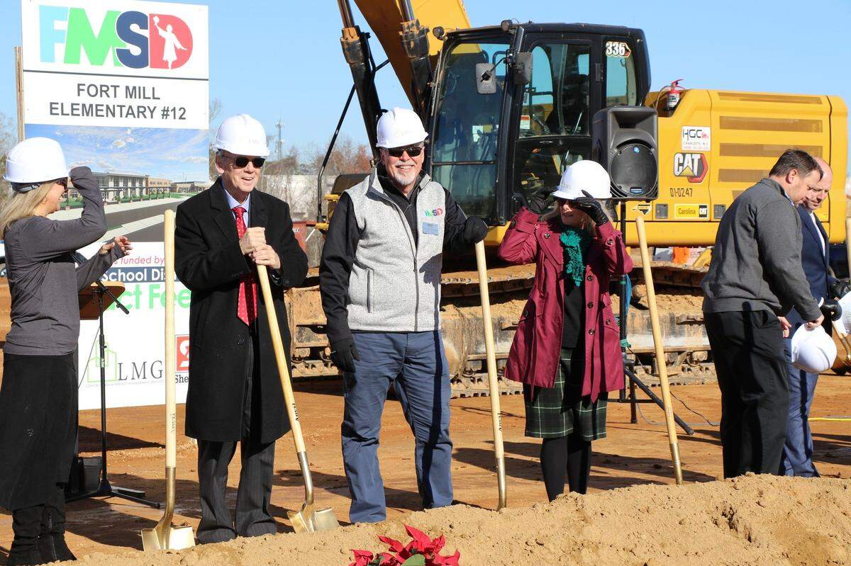 Fort Mill School District staff and board members break ground on the new Flint Hill Elementary School, and a new middle school is slated to be built at the same site.