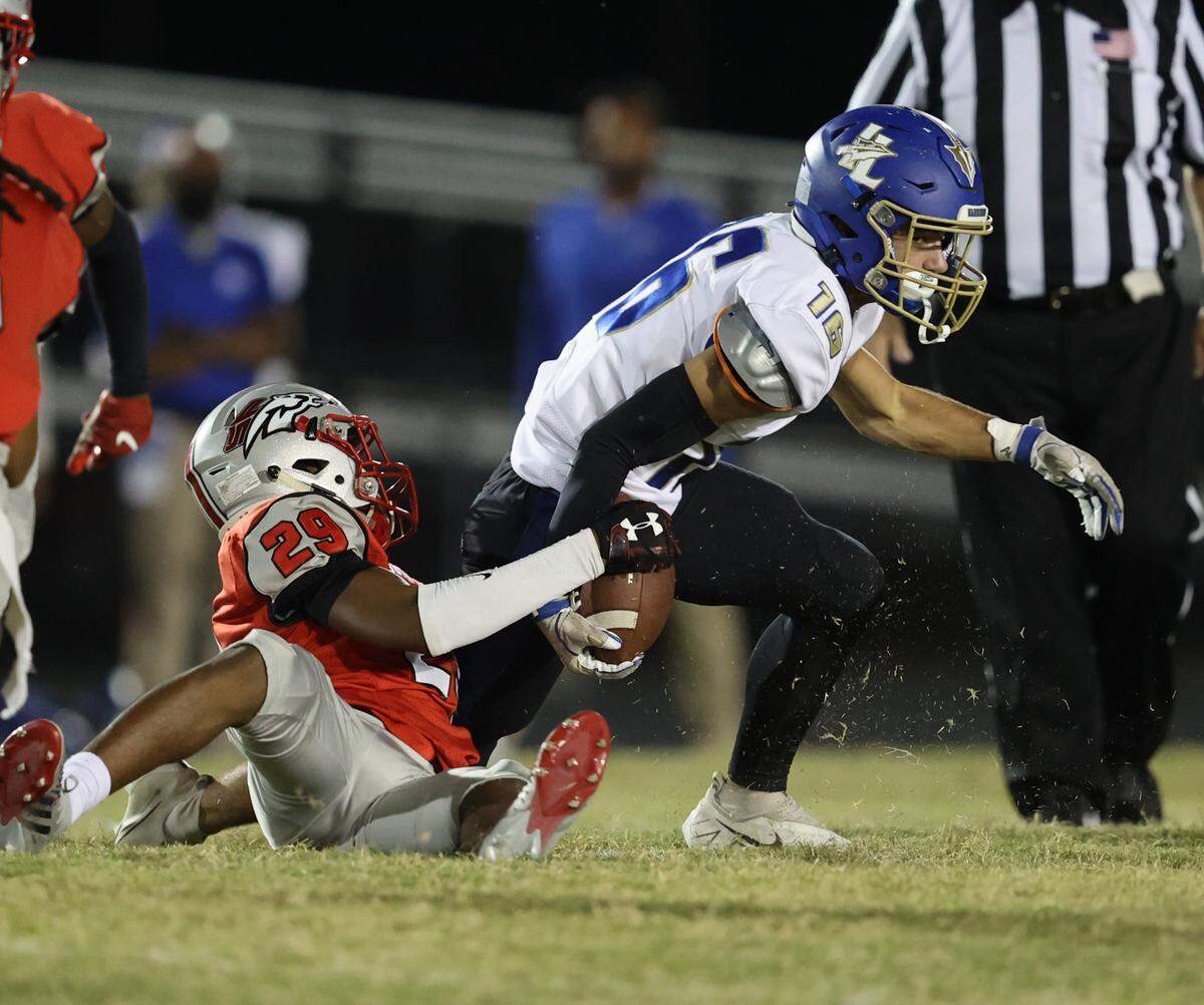 Drew Hardin of Indian Land tries to break free against the South Pointe defense on Friday night (Oct. 15, 2021).
