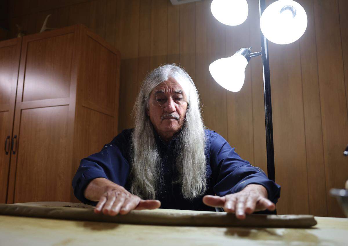 Former Catawba Indian Chief Bill Harris rolls clay Wednesday, July 30 at the Catawba Reservation in Rock Hill.