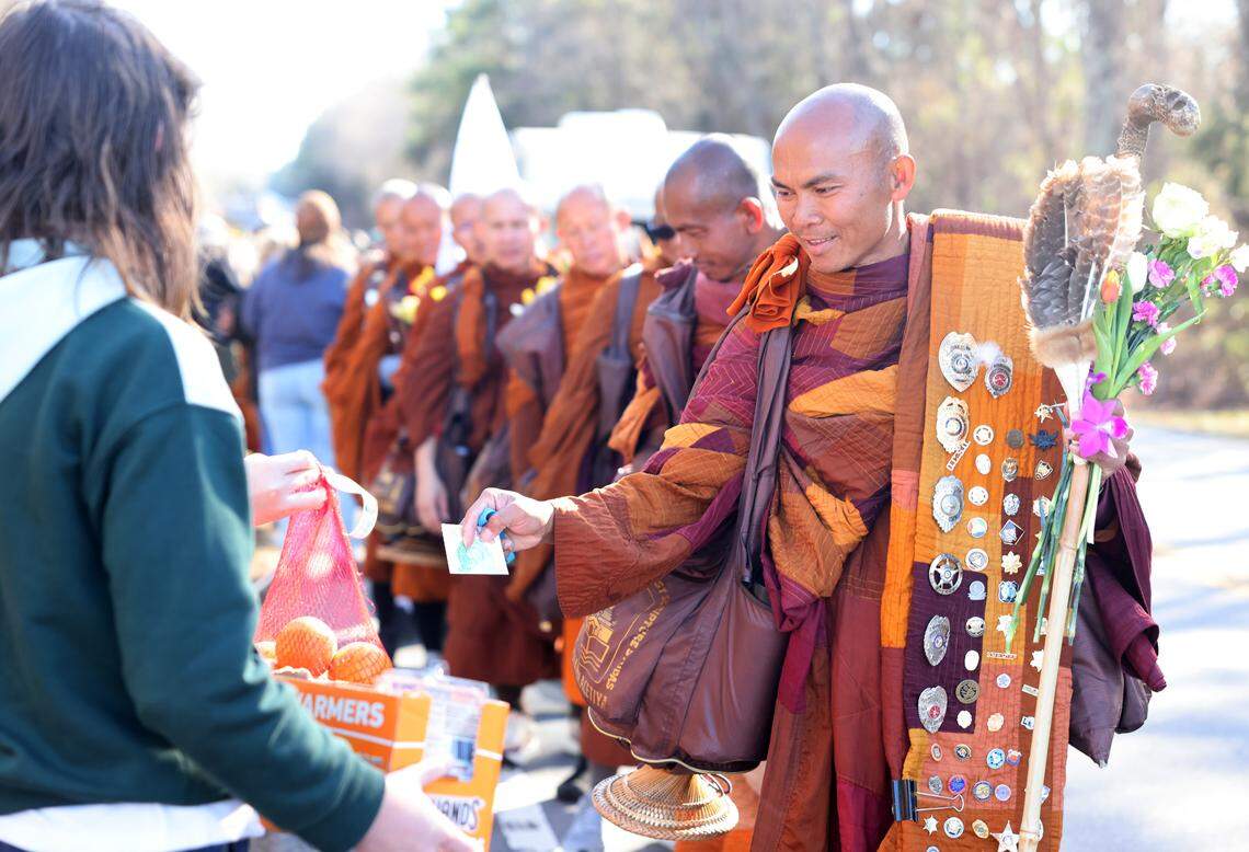 Buddhist monks on their way from Texas to Washington, D.C. walk through Chester County, S.C. on their way to Rock Hill Tuesday and pick up gifts along the way. The group will be in Charlotte Wednesday or Thursday.