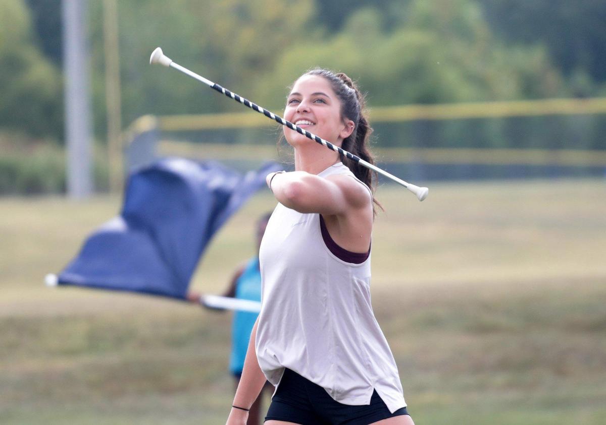 16-year-old Ally Grooms, a majorette in the Clover HIgh School band, practices after school.